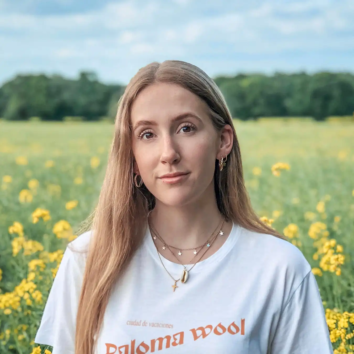 Sophie with wildflower meadow in the background