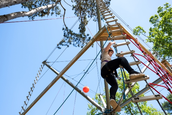 girl enjoying a high ropes activity at a uk activity centre