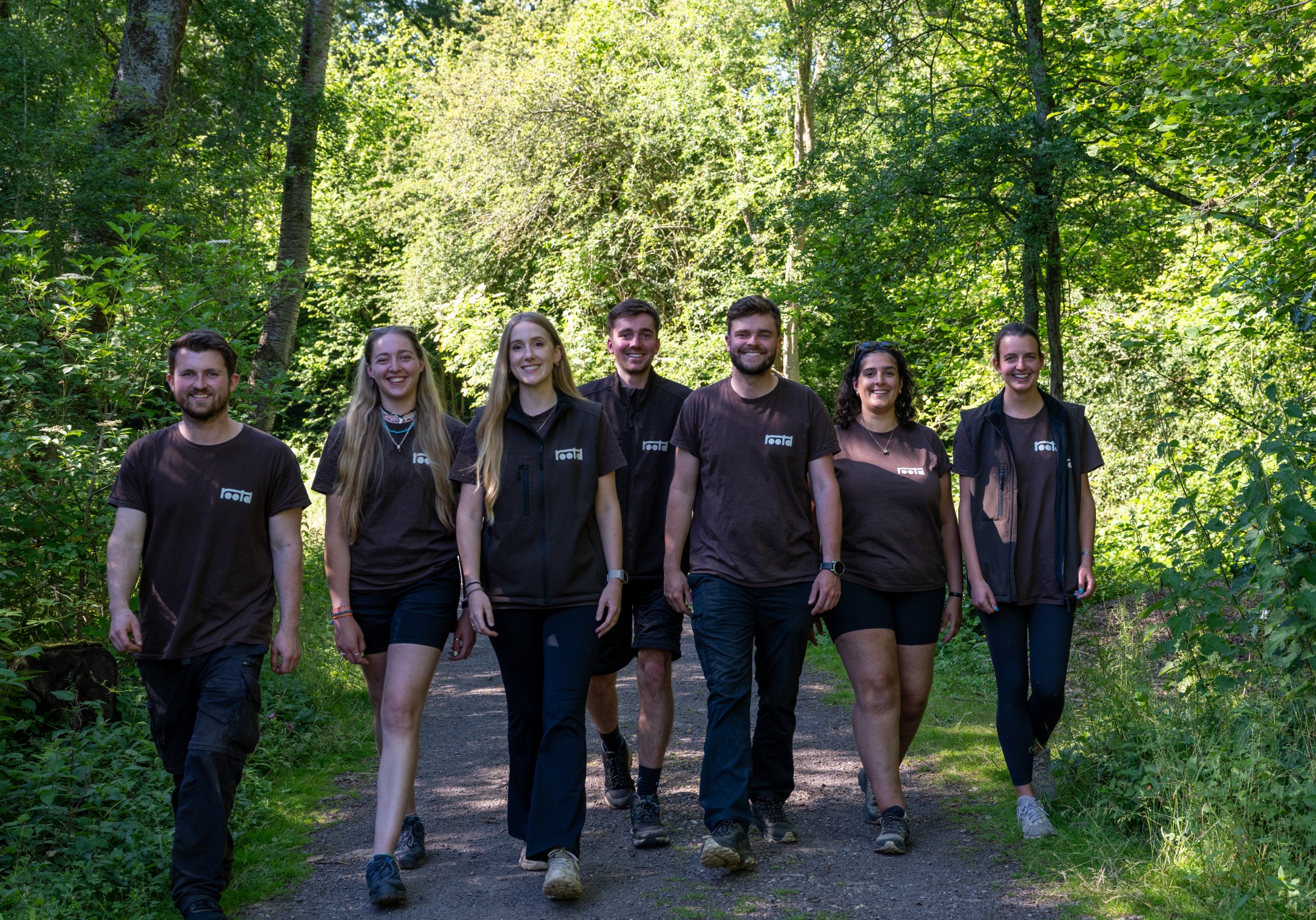 rootd residential team walking in woods