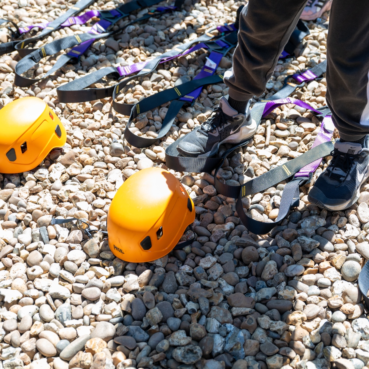 children putting on harness on residential trip